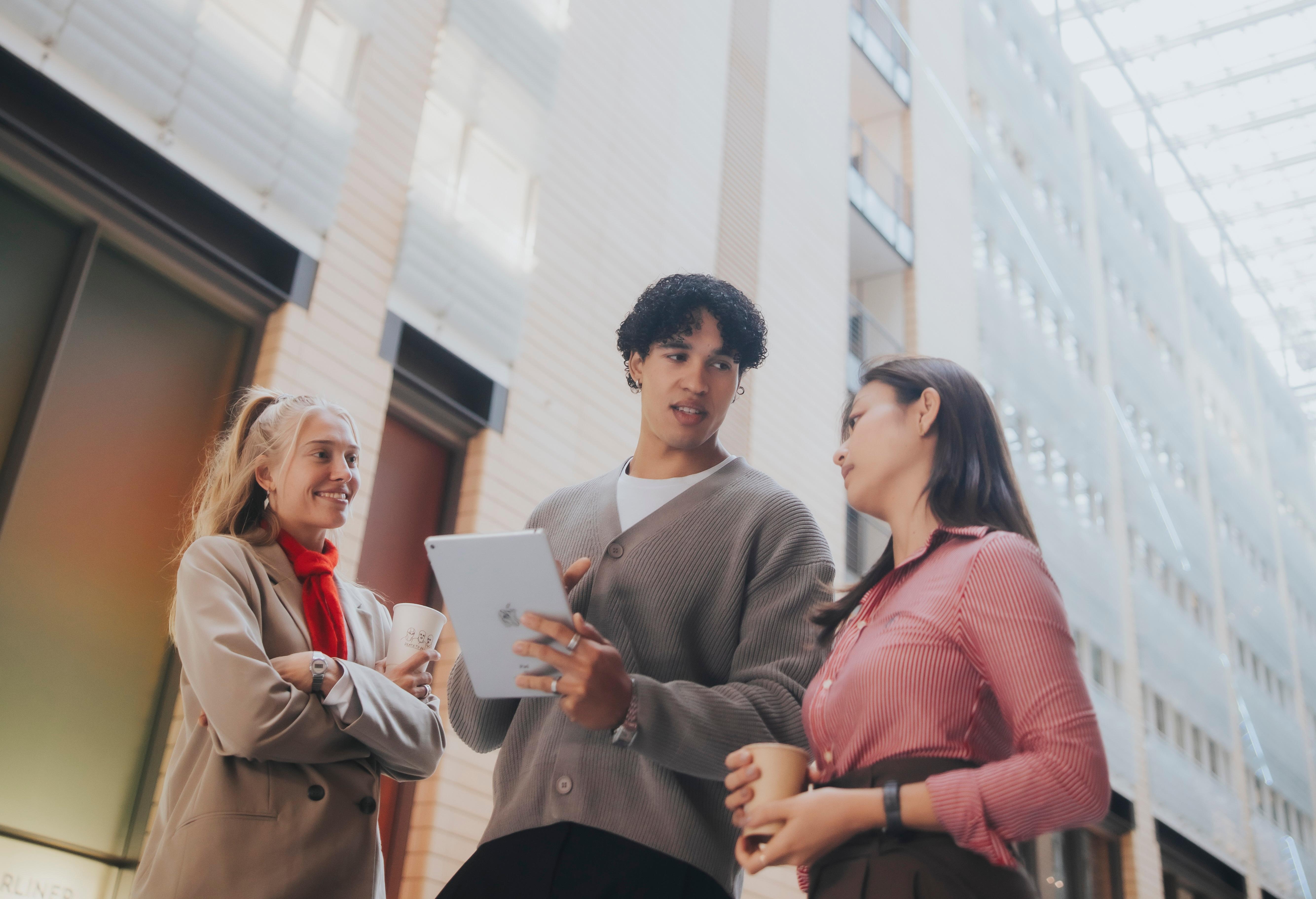 Image of three people meeting