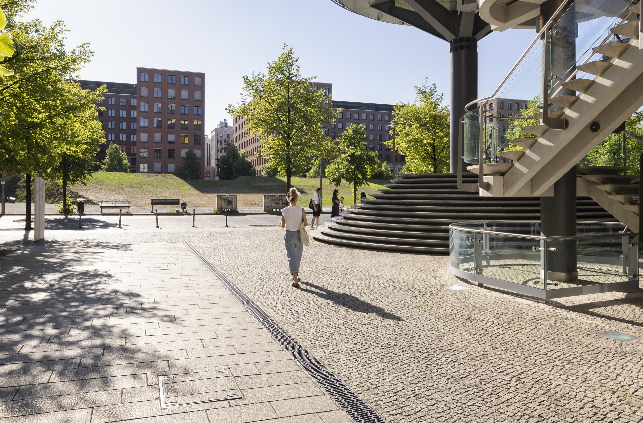 Image of a person walking outside Atrium Tower